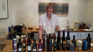 Judy Ridgway with range of oils to taste